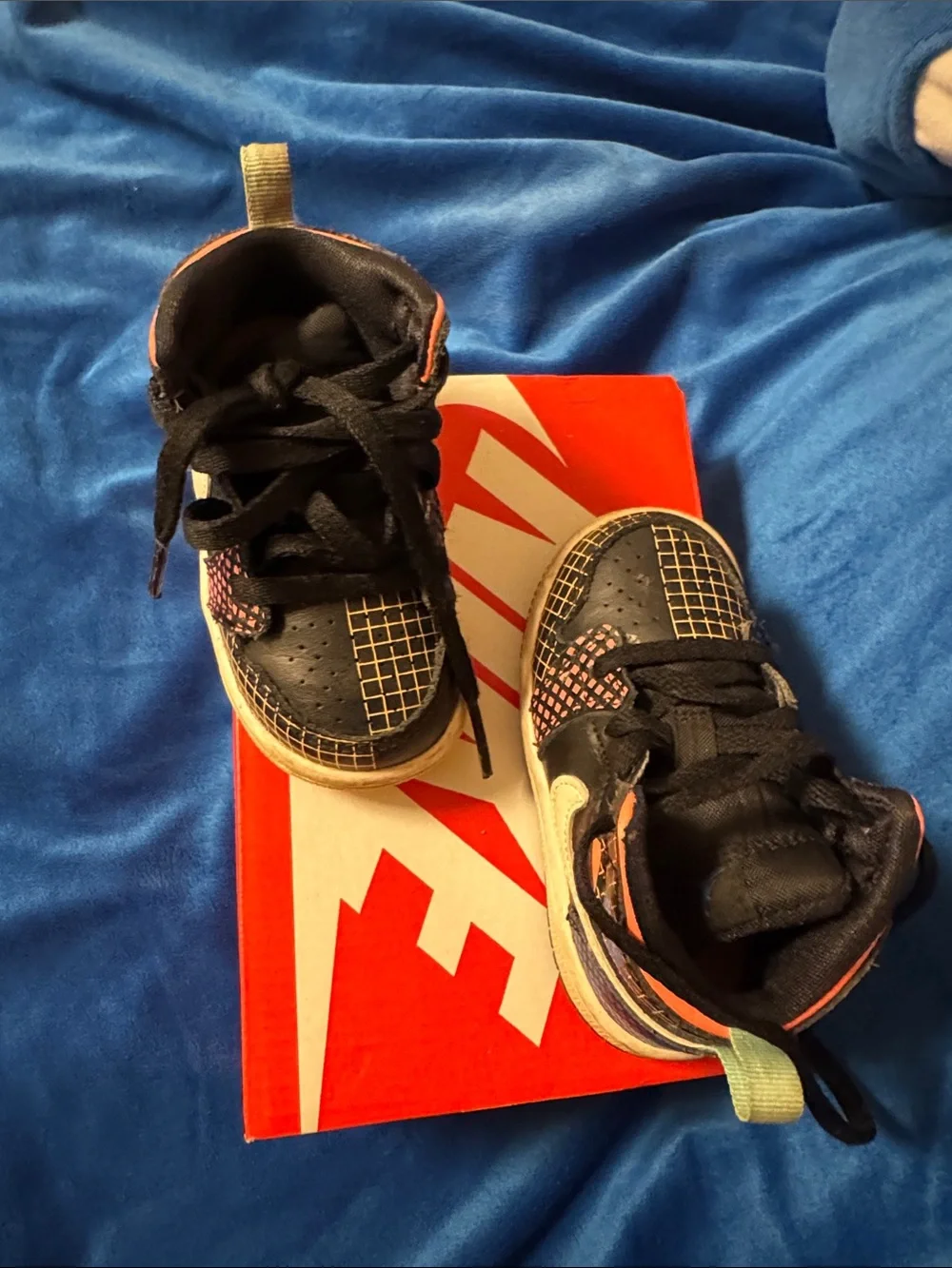 Nike Kids Black Sneakers with Blue and Orange Accents